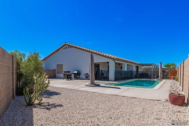 11608 E 26th Ln, Yuma, AZ 85367 - view of pool with ceiling fan, a fenced backyard, a patio, and grilling area
