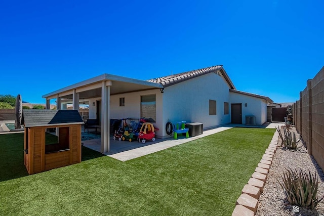 11608 E 26th Ln, Yuma, AZ 85367 - rear view of property featuring a patio area, stucco siding, an outbuilding, cooling unit, and a tiled roof