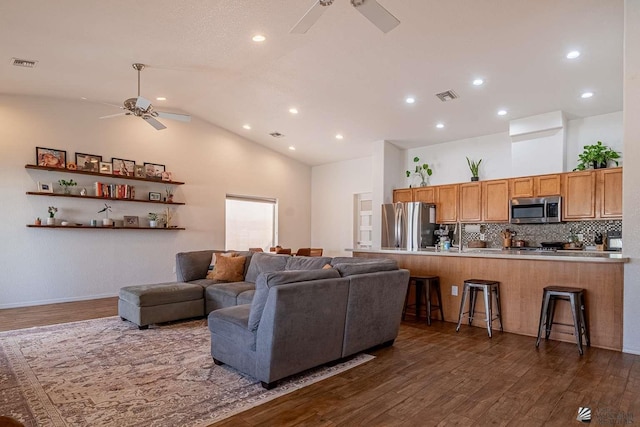 11608 E 26th Ln, Yuma, AZ 85367 - living room featuring ceiling fan, dark wood finished floors, high vaulted ceiling, and recessed lighting