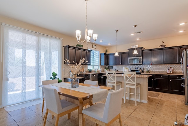 6533 E 35th Pl, Yuma, AZ 85365 - dining room with light tile patterned floors, a chandelier, and recessed lighting