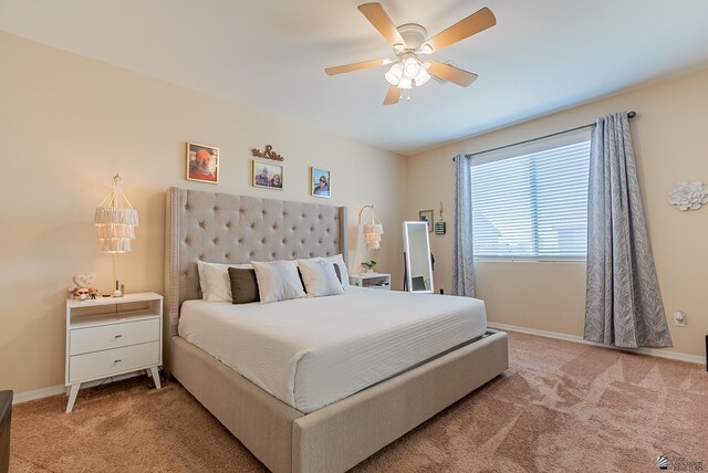6533 E 35th Pl, Yuma, AZ 85365 - bedroom with light colored carpet, baseboards, and ceiling fan