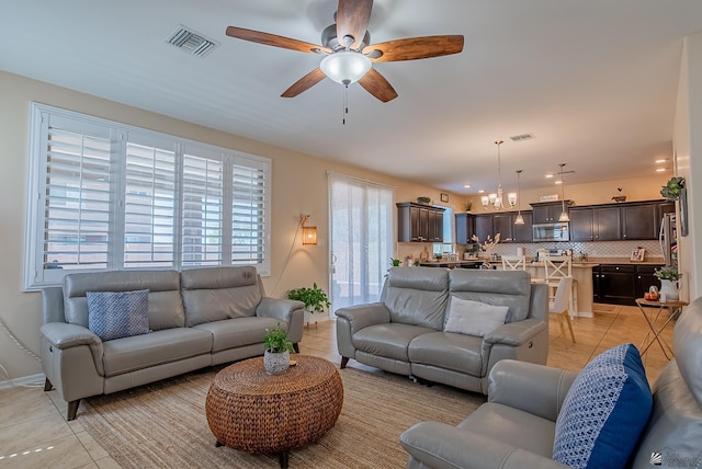 6533 E 35th Pl, Yuma, AZ 85365 - living room with light tile patterned flooring, ceiling fan, and baseboards