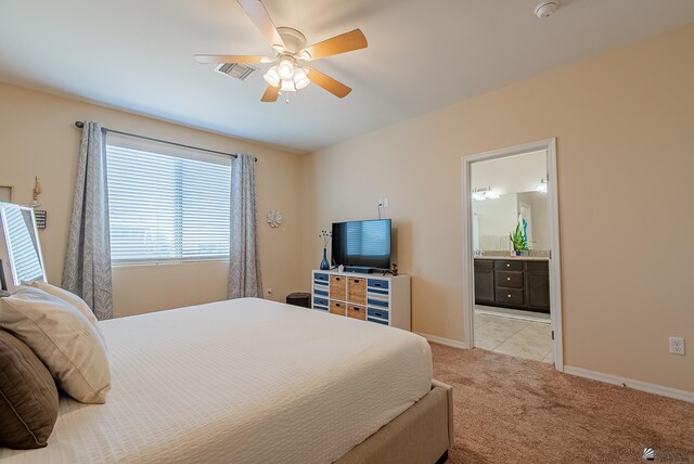 6533 E 35th Pl, Yuma, AZ 85365 - bedroom with light carpet, ensuite bathroom, baseboards, and a ceiling fan