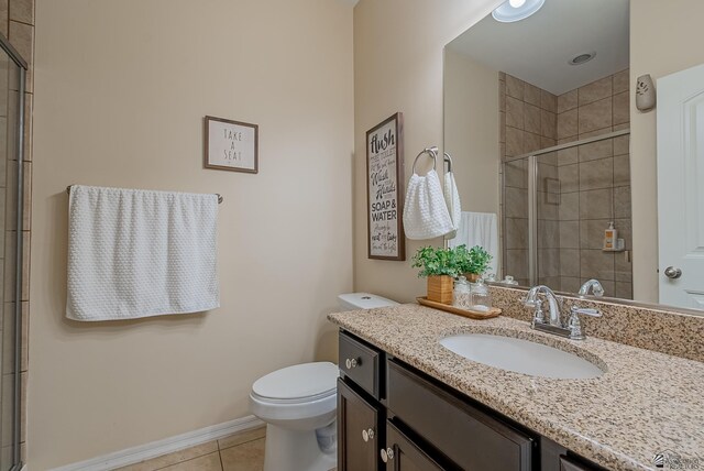 6533 E 35th Pl, Yuma, AZ 85365 - full bathroom with vanity, tile patterned flooring, toilet, tiled shower, and baseboards