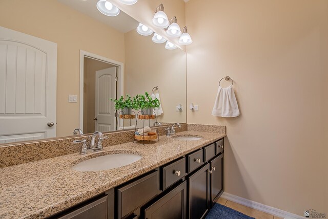6533 E 35th Pl, Yuma, AZ 85365 - bathroom featuring double vanity, tile patterned flooring, and baseboards