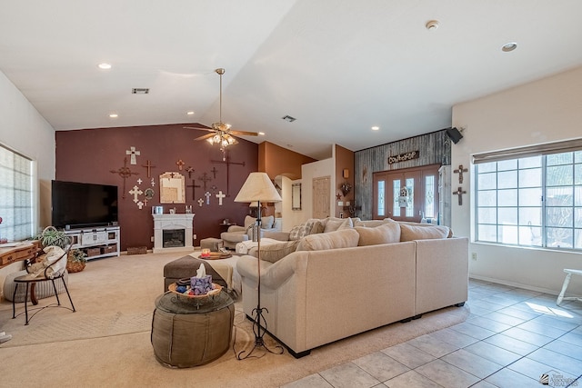 living area with ceiling fan with notable chandelier, recessed lighting, lofted ceiling, and visible vents