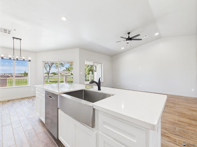 12116 E Calle Del Cid Unit B, Yuma, AZ 85367 - kitchen with stainless steel dishwasher, recessed lighting, ceiling fan, light wood-type flooring, and decorative light fixtures