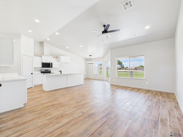 12116 E Calle Del Cid Unit B, Yuma, AZ 85367 - unfurnished living room with a ceiling fan, light wood-type flooring, recessed lighting, and high vaulted ceiling