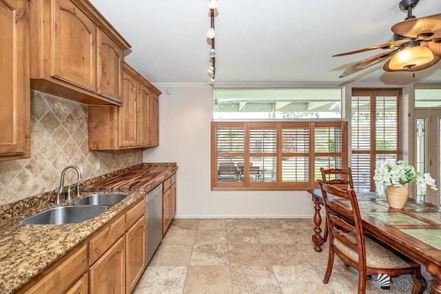 500 E Country Club Dr # 14, Yuma, AZ 85365 - kitchen featuring a sink, dishwasher, a ceiling fan, baseboards, and backsplash