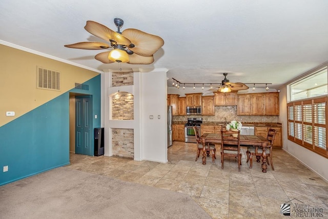 500 E Country Club Dr # 14, Yuma, AZ 85365 - dining space featuring crown molding, a ceiling fan, baseboards, and visible vents