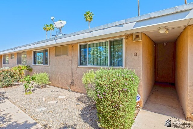 500 E Country Club Dr # 14, Yuma, AZ 85365 - view of exterior entry featuring stucco siding