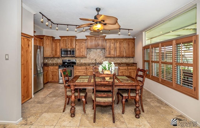 500 E Country Club Dr # 14, Yuma, AZ 85365 - dining space featuring baseboards, ornamental molding, and ceiling fan