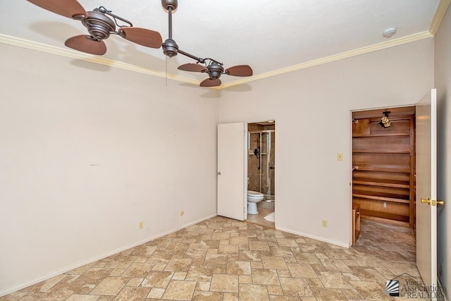 500 E Country Club Dr # 14, Yuma, AZ 85365 - unfurnished bedroom with crown molding, baseboards, a walk in closet, stone finish floor, and connected bathroom
