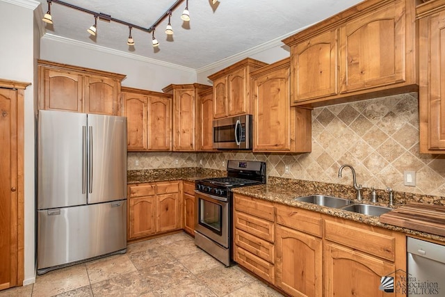 500 E Country Club Dr # 14, Yuma, AZ 85365 - kitchen with a sink, appliances with stainless steel finishes, backsplash, and brown cabinets
