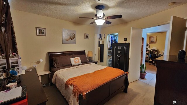4671 W 21st Ln, Yuma, AZ 85364 - bedroom featuring a textured ceiling, light carpet, and ceiling fan