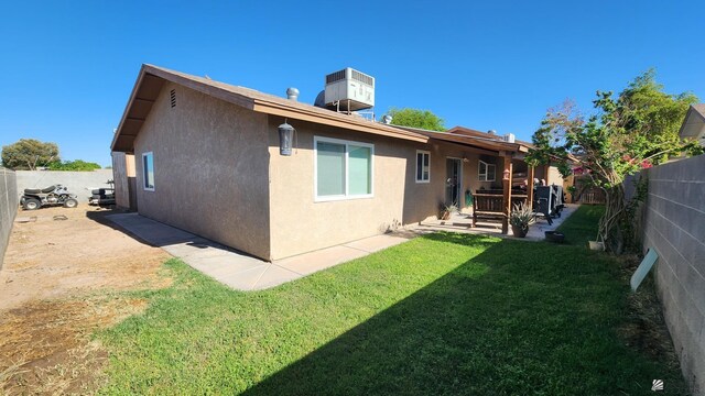 4671 W 21st Ln, Yuma, AZ 85364 - rear view of property with stucco siding, a fenced backyard, and a patio