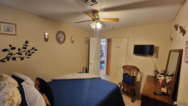 4671 W 21st Ln, Yuma, AZ 85364 - bedroom featuring a ceiling fan and a textured ceiling