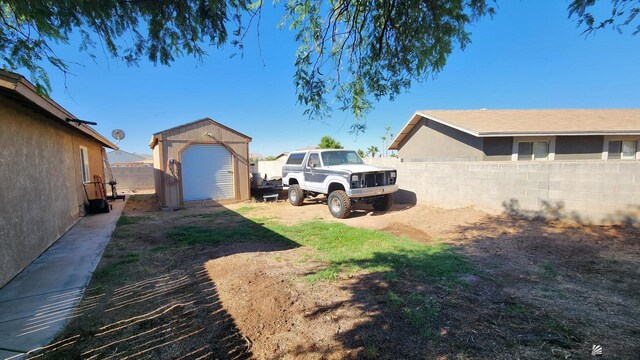 4671 W 21st Ln, Yuma, AZ 85364 - fenced backyard with a storage unit