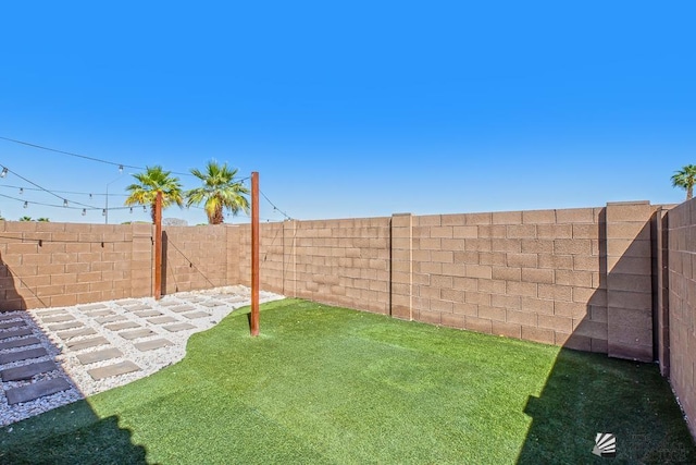 view of yard featuring a fenced backyard