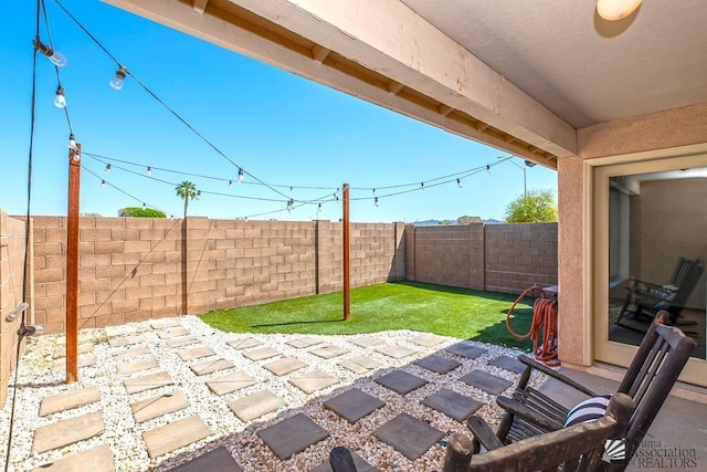 view of patio featuring a fenced backyard