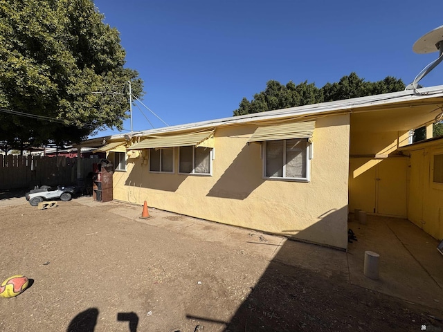 exterior space featuring stucco siding