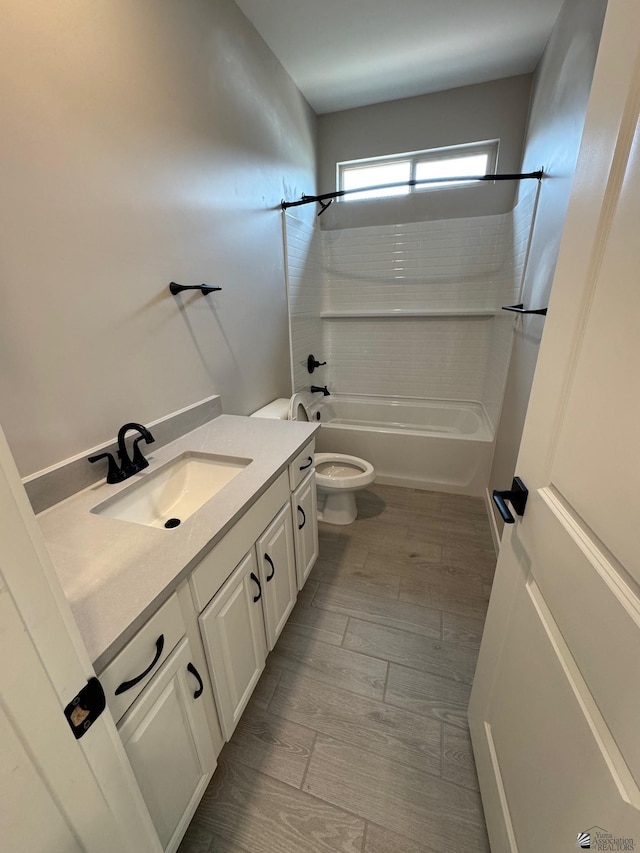 7701 E 35th Pl, Yuma, AZ 85365 - full bathroom with toilet,  shower combination, wood finished floors, and vanity
