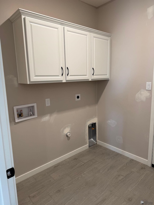 7701 E 35th Pl, Yuma, AZ 85365 - washroom featuring cabinet space, washer hookup, baseboards, wood finished floors, and hookup for an electric dryer