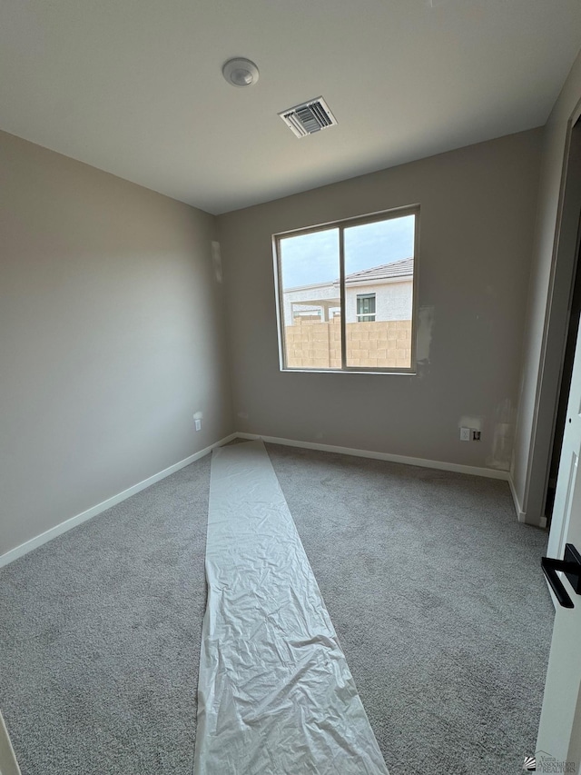 7701 E 35th Pl, Yuma, AZ 85365 - unfurnished room featuring carpet floors, baseboards, and visible vents