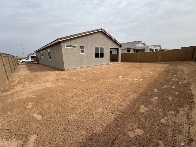 7701 E 35th Pl, Yuma, AZ 85365 - rear view of property featuring fence and stucco siding