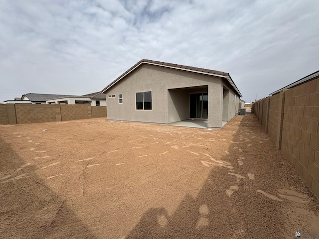 7701 E 35th Pl, Yuma, AZ 85365 - rear view of property featuring a fenced backyard, stucco siding, and a patio area
