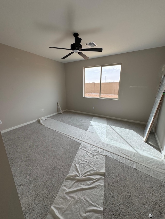 7701 E 35th Pl, Yuma, AZ 85365 - spare room with visible vents, a ceiling fan, carpet, and baseboards