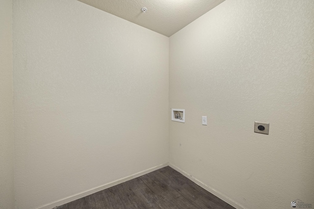 washroom featuring hardwood / wood-style flooring, washer hookup, hookup for an electric dryer, and a textured ceiling