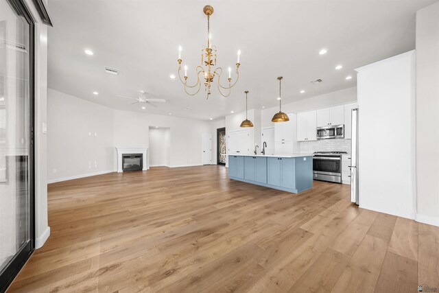 10369 S Fairway Loop, Yuma, AZ 85367 - kitchen with stainless steel appliances, a chandelier, recessed lighting, open floor plan, and a ceiling fan
