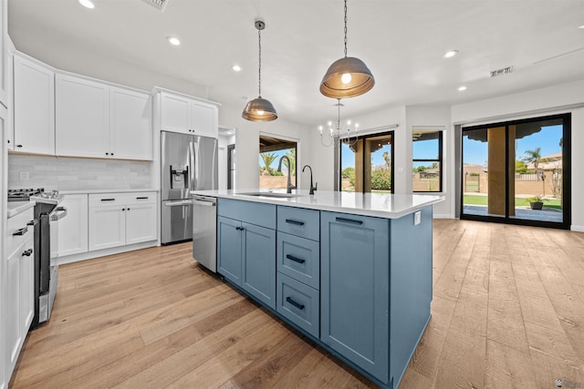 10369 S Fairway Loop, Yuma, AZ 85367 - kitchen featuring stainless steel appliances, white cabinetry, recessed lighting, light countertops, and light wood-style flooring