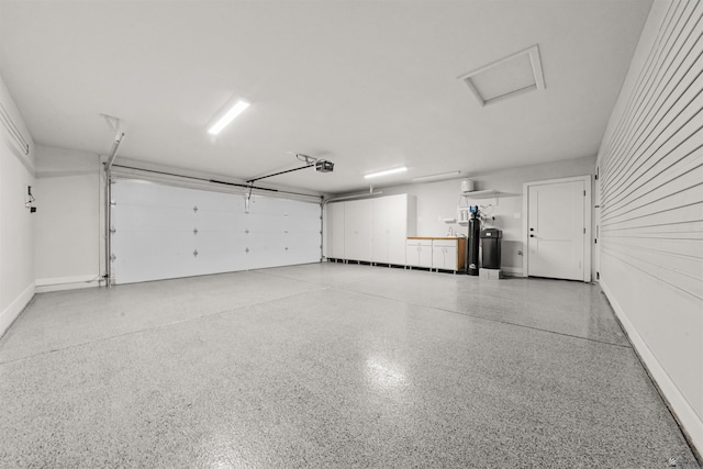 10369 S Fairway Loop, Yuma, AZ 85367 - garage featuring a garage door opener and baseboards