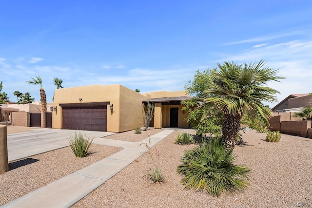 10369 S Fairway Loop, Yuma, AZ 85367 - adobe home with an attached garage, stucco siding, and concrete driveway