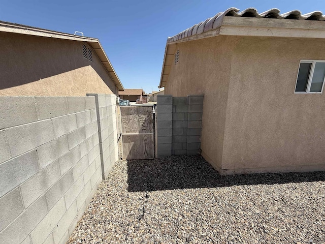6347 E 44th Pl, Yuma, AZ 85365 - view of home's exterior featuring a gate and stucco siding