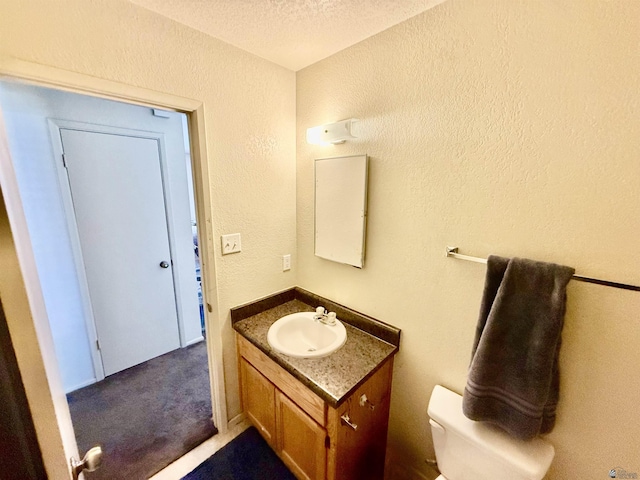6347 E 44th Pl, Yuma, AZ 85365 - bathroom with a textured wall, vanity, and a textured ceiling