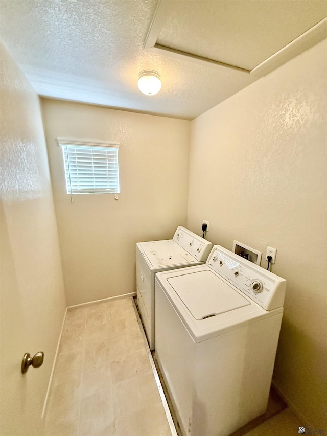 6347 E 44th Pl, Yuma, AZ 85365 - washroom with washer and clothes dryer, a textured ceiling, and light tile patterned floors