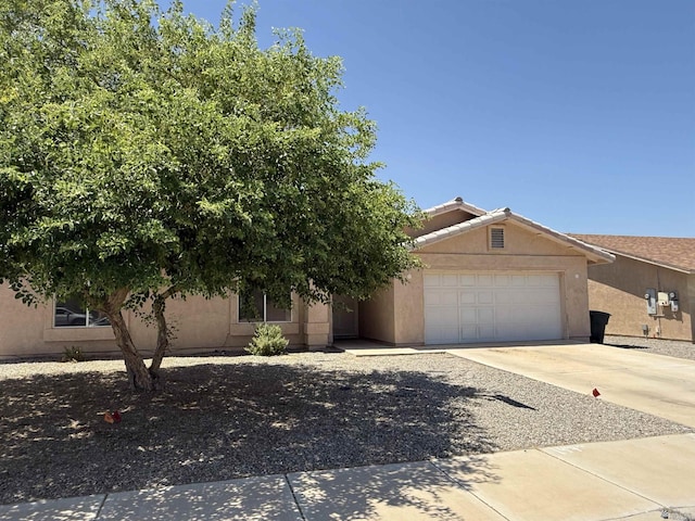 6347 E 44th Pl, Yuma, AZ 85365 - view of front of property featuring an attached garage, concrete driveway, and stucco siding