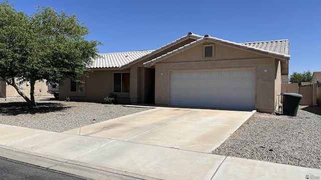 6347 E 44th Pl, Yuma, AZ 85365 - single story home with a tile roof, a garage, stucco siding, and concrete driveway