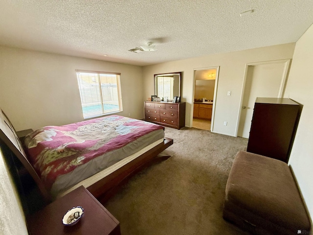 6347 E 44th Pl, Yuma, AZ 85365 - carpeted bedroom with a textured ceiling and ensuite bath