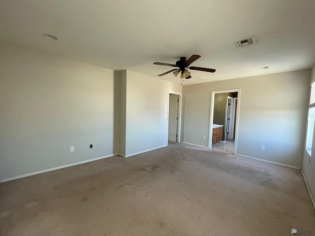 unfurnished room with ceiling fan and light colored carpet