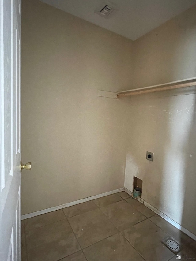 washroom featuring tile patterned flooring, hookup for a washing machine, and hookup for an electric dryer