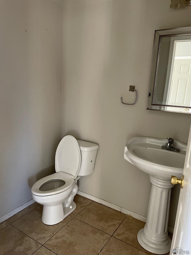 bathroom featuring tile patterned floors and toilet