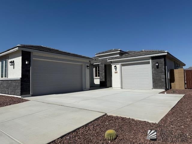 12310 S Aloa Ln, Yuma, AZ 85367 - prairie-style house with an attached garage, driveway, and stucco siding