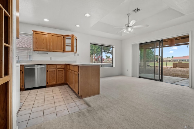 10266 S Del Rico, Yuma, AZ 85367 - kitchen with ceiling fan, light colored carpet, dishwasher, light countertops, and a peninsula