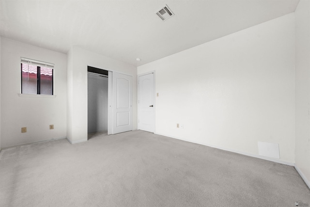 10266 S Del Rico, Yuma, AZ 85367 - unfurnished bedroom featuring baseboards, visible vents, light carpet, and a closet