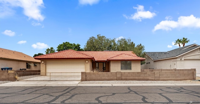10266 S Del Rico, Yuma, AZ 85367 - view of front of property featuring fence, an attached garage, a tile roof, stucco siding, and driveway