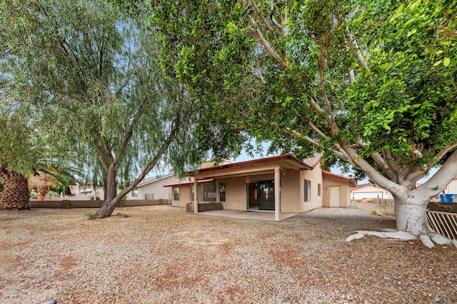 10266 S Del Rico, Yuma, AZ 85367 - rear view of property with fence, a patio, and stucco siding